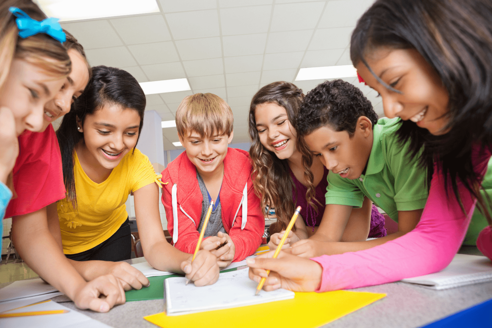 Kids practicing writing during KidsWow English
